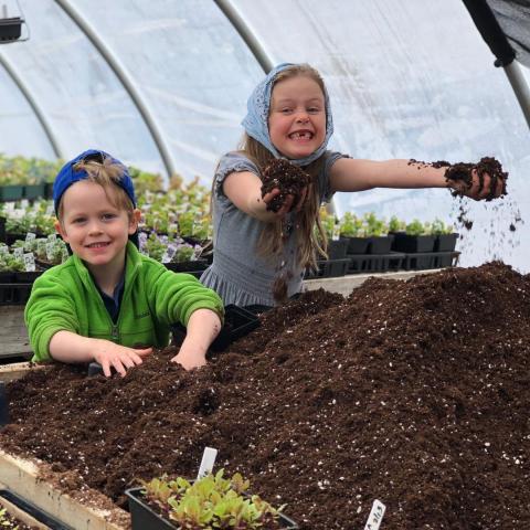 kids enjoying some soil