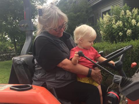 Helene and her grand-daughter on a tractor